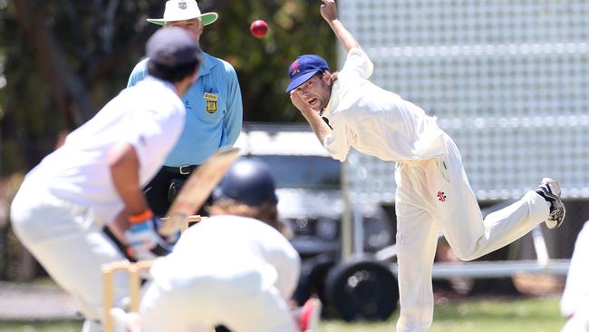 Payneham’s Mark Barber bowling on the troublesome Payneham Oval pitch. Picture: Stephen Laffer