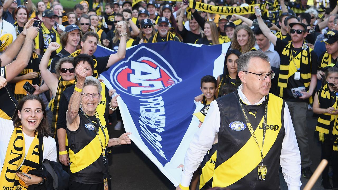 Tigers fans carried the 2017 premiership flag from Punt Road to the MCG ahead of Round 1, 2018. Picture: Quinn Rooney