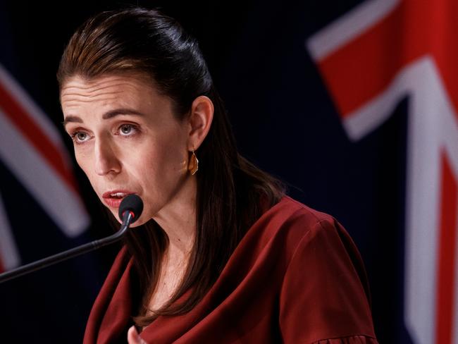 WELLINGTON, NEW ZEALAND - AUGUST 23: New Zealand Prime Minister Jacinda Ardern talks to the media at the COVID-19 update and Post Cabinet press conference at the Beehive Theatrette on August 23, 2021 in Wellington, New Zealand. Prime Minister Jacinda Ardern has announced COVID-19 Alert Level 4 lockdown restrictions will remain in place across New Zealand until 27 August, while Auckland will remain in lockdown until 31 August. Under COVID-19 Alert Level 4 measures, people are instructed to stay at home in their bubble other than for essential reasons, with travel severely limited. All non-essential businesses are closed, including bars, restaurants, cinemas and playgrounds. All indoor and outdoor events are banned, while schools have switched to online learning. Essential services remain open, including supermarkets and pharmacies. (Photo by Robert Kitchin - Pool/Getty Images)