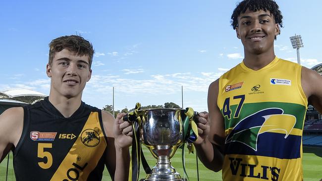 SANFL U18 Grand final captains Hugh Stagg (Glenelg) and Jordan Lukac (Eagles) together with the U18 premiership cup at Adelaide Oval.Wednesday September 15, 2021. Photo: Roy VanDerVegt