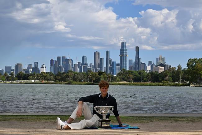 Italy's Jannik Sinner poses with the Australian Open trophy