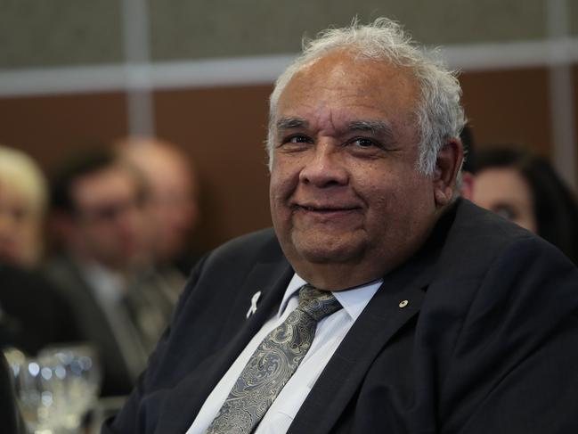 Tom Calma listening to Minister for Indigenous Australians Ken Wyatt during his address to the National Press Club in Canberra. Picture Kym Smith