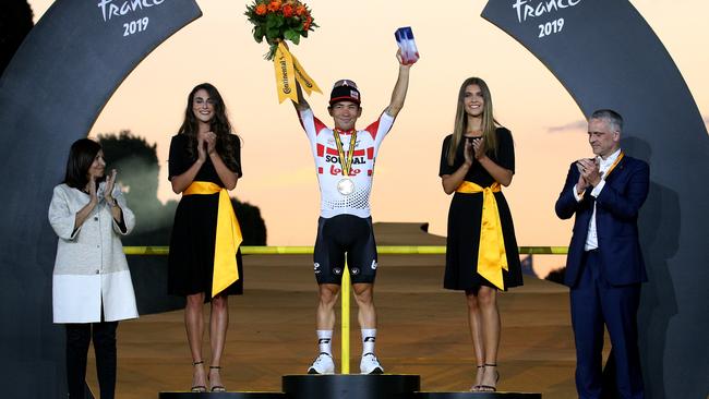 Australian sprinter Caleb Ewan celebrates on the podium after winning Stage 21 of the Tour de France last year Picture: Getty Images