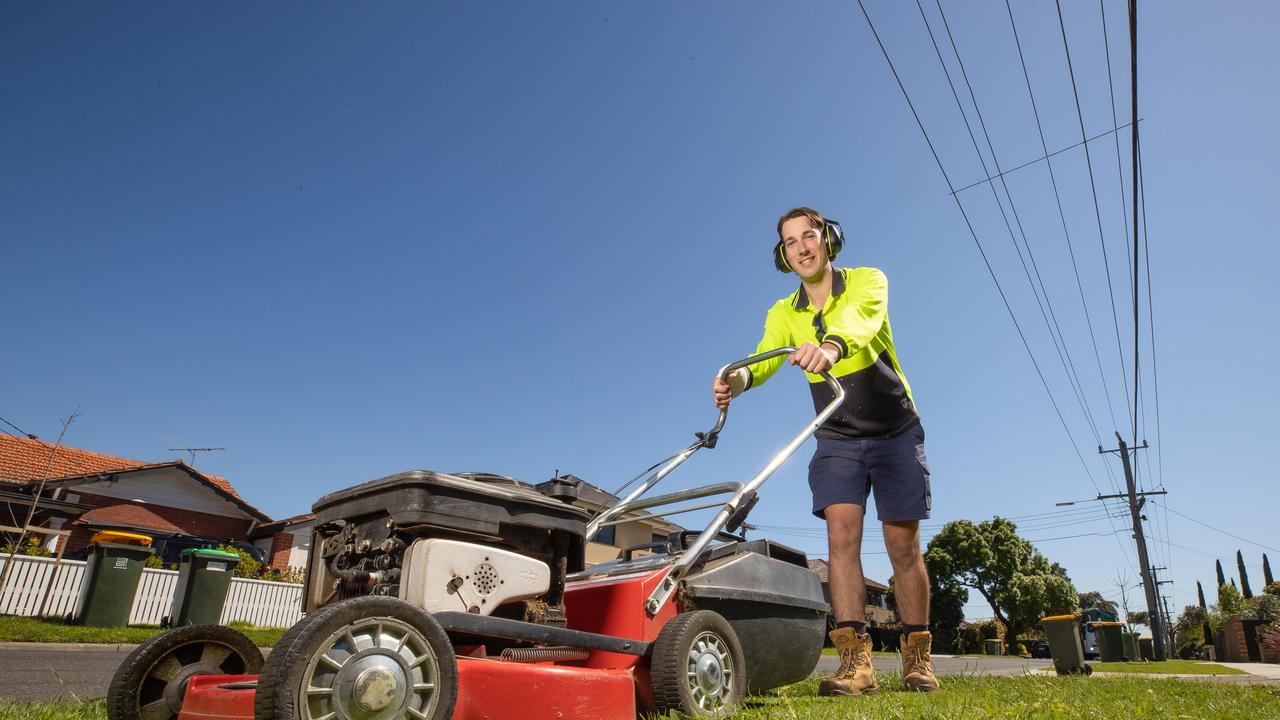 Jackson Doyle mowing his front nature strip in Bentleigh. Picture: Jason Edwards