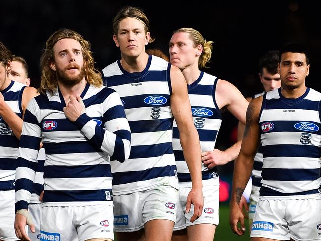 ADELAIDE, AUSTRALIA - JUNE 22: Geelong Cats players walk from the ground looking dejected during the round 14 AFL match between the Port Adelaide Power and the Geelong Cats at Adelaide Oval on June 22, 2019 in Adelaide, Australia. (Photo by Daniel Kalisz/Getty Images)