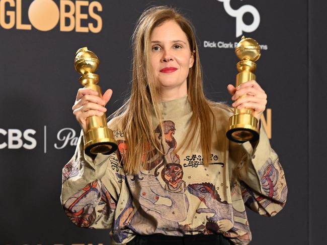 French director Justine Triet poses with the awards for Best Screenplay - Motion Picture and Best Motion Picture for Non-English Language for Anatomy of a Fall. Picture: AFP