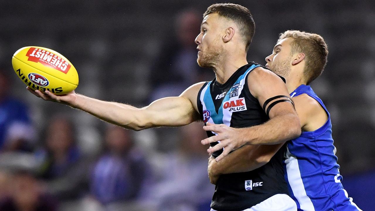 Robbie Gray of the Power takes a mark ahead of Ed Vickers-Willis of the Kangaroos, during the Round 6 AFL match between North Melbourne Kangaroos and Port Adelaide Power at Etihad Stadium in Melbourne, Saturday, April 28, 2018. (AAP Image/Joe Castro) NO ARCHIVING EDITORIAL USE ONLY