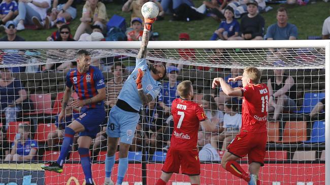 Adelaide keeper Paul Izzo stretches to make a save. Picture: AAP