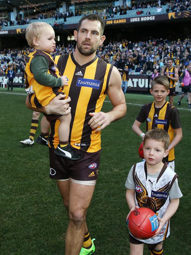 Luke Hodge on the MCG with his sons Leo (left), Chase (white jumper) and Cooper (back). Pic: Michael Klein.
