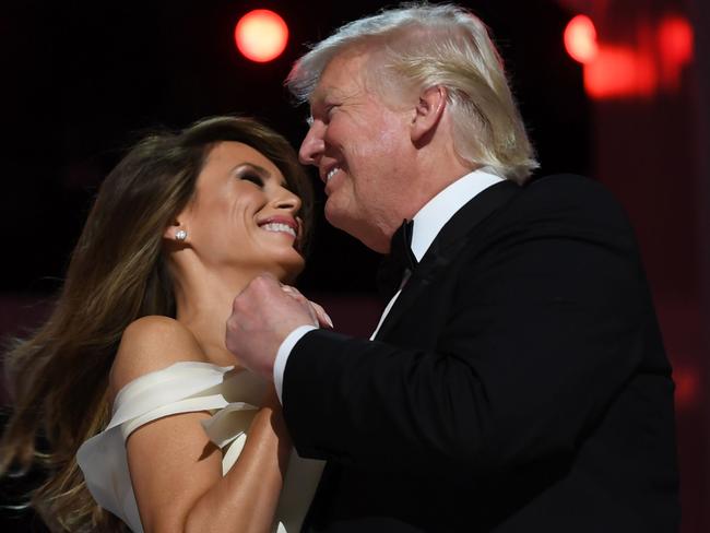 (FILES) US President Donald Trump and the first lady Melania Trump dance at the Liberty Ball at the Washington DC Convention Center following Donald Trump's inauguration as the 45th President of the United States, in Washington, DC, on January 20, 2017.  While the new US president has shown a capacity to change, both his tone and his positions, he has been unable to show the world a "new" Trump, with a steady presidential style and a clearly articulated worldview. As the symbolic milestone of his 100th day in power, which falls on April 29, 2017, draws near, a cold, hard reality is setting in for the billionaire businessman who promised Americans he would "win, win, win" for them. At this stage of his presidency, he is the least popular US leader in modern history (even if his core supporters are still totally behind him.) / AFP PHOTO / JIM WATSON / TO GO WITH AFP STORY, US-politics-Trump-100days