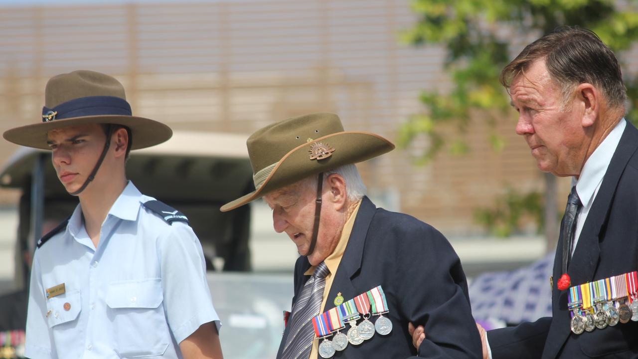 Elderly veterans were assisted to lay wreaths at the memorial in Cleveland today. Picture Andrea Macleod