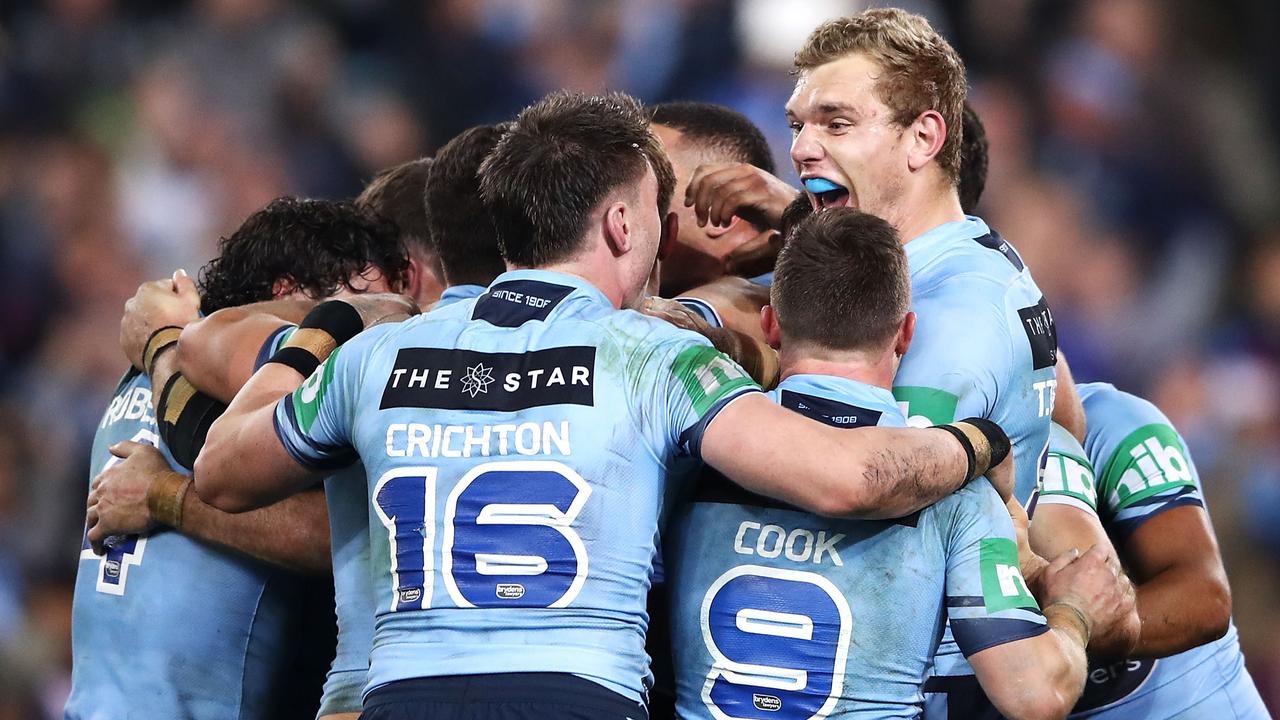 The Blues celebrate victory after game two of the State of Origin series. (Photo by Mark Kolbe/Getty Images)