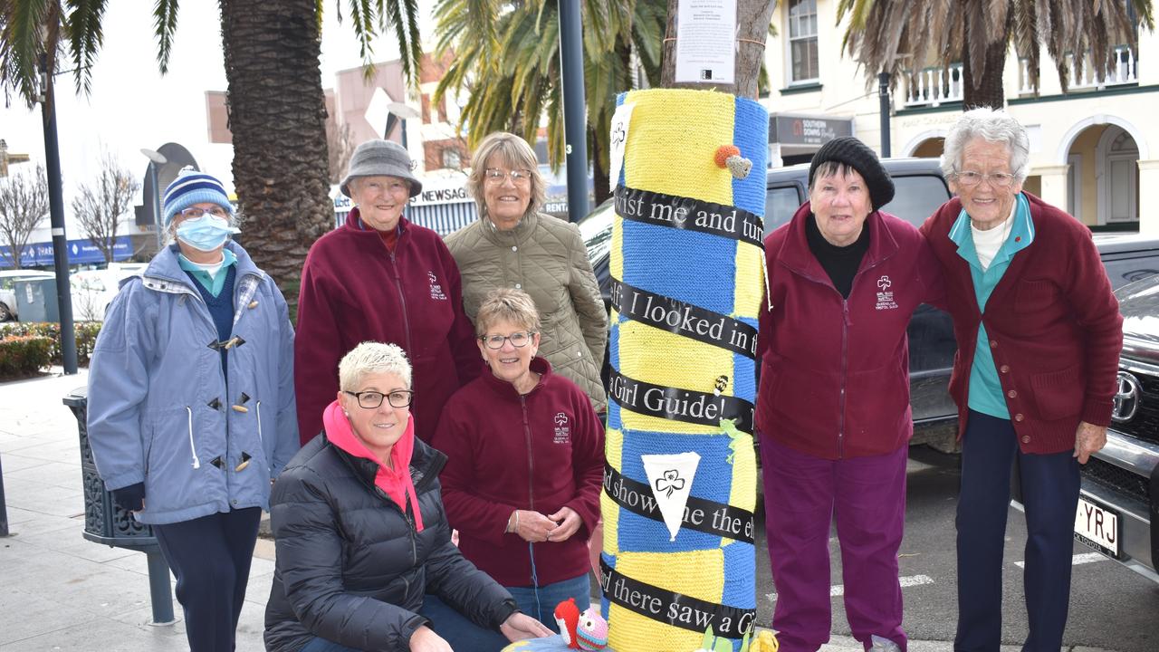 (clockwise from front left) Carly Hansen, Heather Watt, Caroline Hunter, Margaret Adcock, Ann-Maree Clark, Heather Guimer, and Kerri Collins with the joint Warwick Girl Guides and Girl Guides Trefoil tree jumper. Photo Jessica Paul / Warwick Daily News