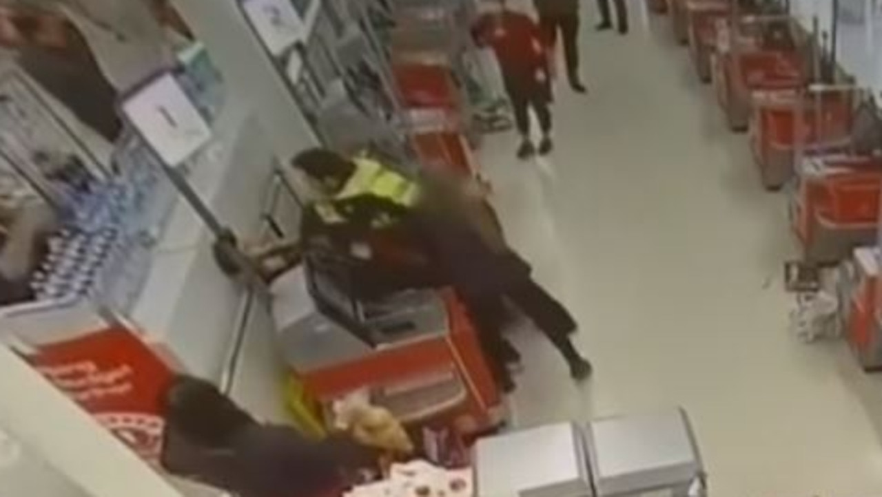 A nearby manager steps in and tries to pull the two apart. Picture: 7 NEWS