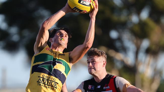 Woodville-West Torrens’ Sam Rowland marks strongly in front of West Adelaide’s Nick Steele in the Eagles’ hard-fought 13-point win at Woodville on Saturday. Picture: SANFL Image/David Mariuz.