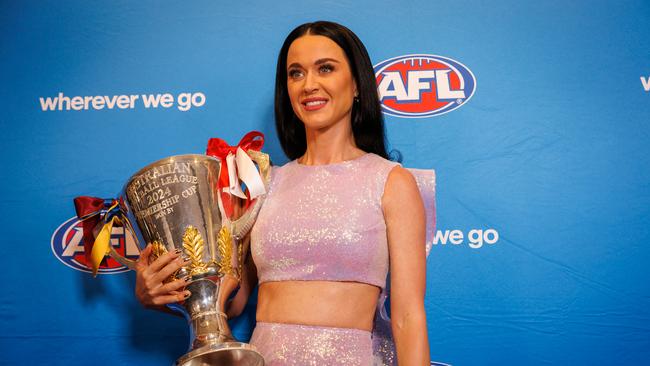 Katy Perry got her hands on the McClelland Trophy ahead of grand final day. Picture: NewsWire/Nadir Kinani