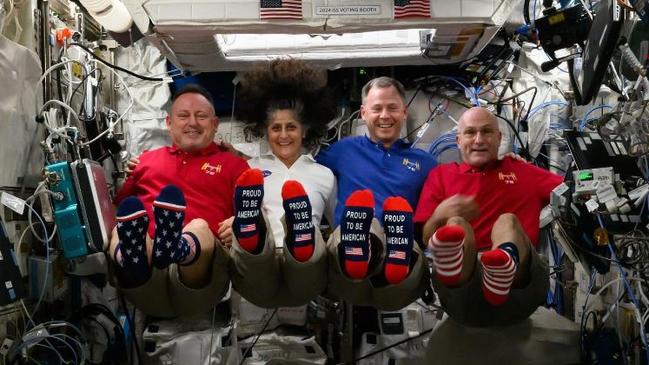 Astronauts – including Ms Williams (centre left) and Mr Wilmore (left) celebrated the 2024 U.S. election with a red white and blue dress code and patriotic socks. Photo: Instagram