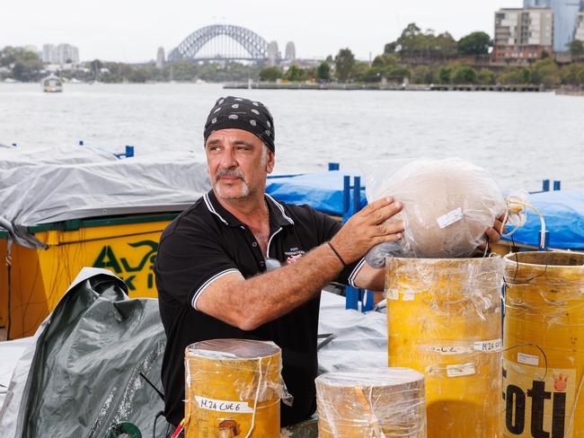 Forunato Forti making NYE fireworks preparations on a barge off Glebe Island port. Picture: NCA NewsWire / David Swift