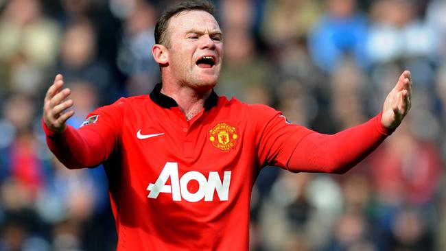 FILE - This is a Saturday, March 8, 2014 file photo of Manchester United's Wayne Rooney as he shouts instructions to teammates during the English Premier League soccer match between West Bromwich Albion and Manchester United at The Hawthorns Stadium in West Bromwich, England. Manchester United on Monday July 14, 2014 secured the most lucrative kit deal in football, announcing that Adidas has agreed to pay $1.3 billion over 10 years to take over the sponsorship from Nike. The deal, worth 75 million pounds ($128 million) a year from 2015, was announced after Nike decided that trebling the cost of its existing 13-year equipment supply contract was not good value for the company. (AP Photo/Rui Vieira, File)