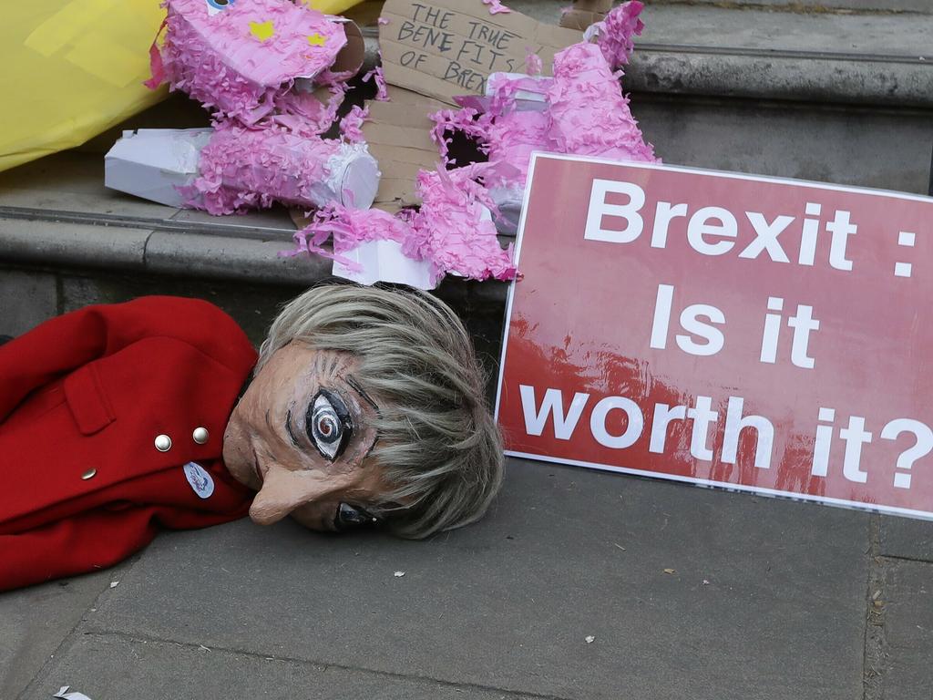 A puppet of British Prime Minister Theresa May lays on the ground during a Peoples Vote anti-Brexit march in London. Picture: AP Photo/Kirsty Wigglesworth