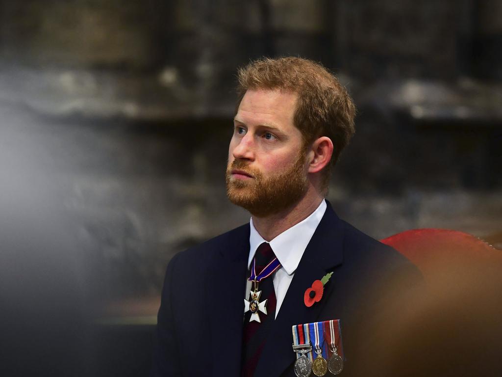 Harry has a serious moment inside Westminster Abbey. Picture: AP