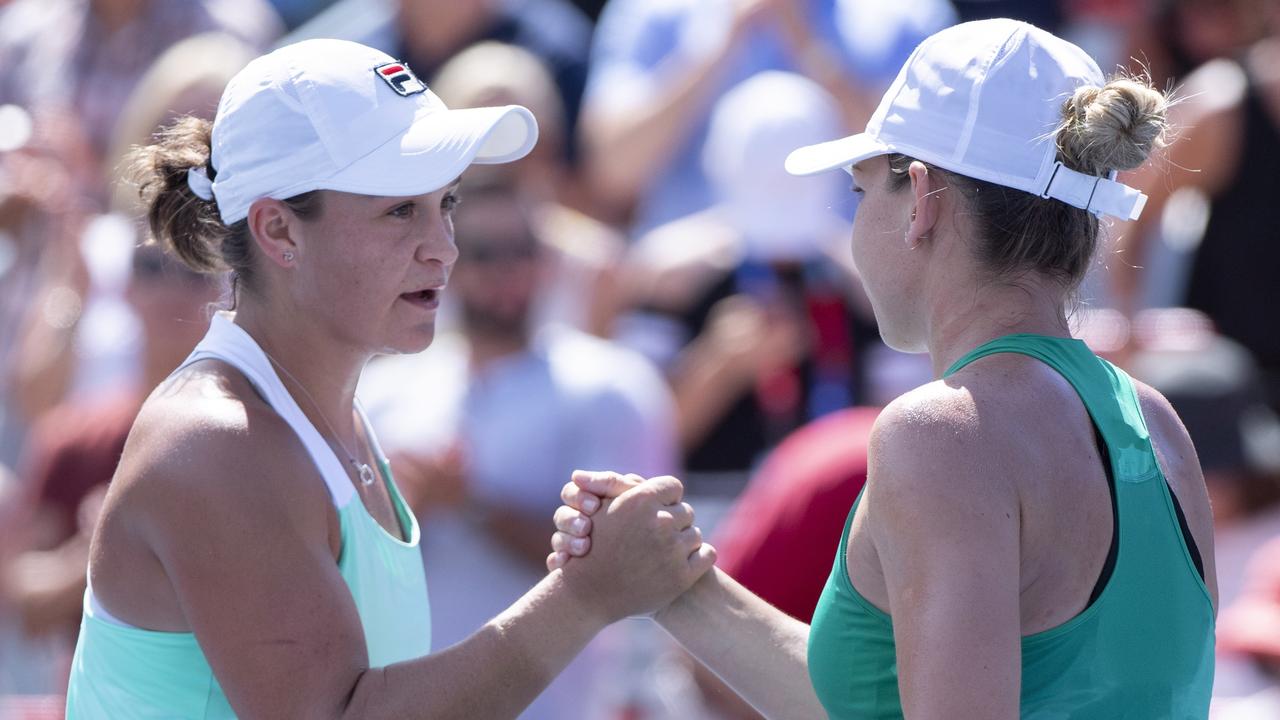 Ashleigh Barty of Australia, left, congratulates Simona Halep of Romania for her victory in semi-finals play at the Rogers Cup tennis tournament Saturday, Aug. 11, 2018 in Montreal. (Paul Chiasson/The Canadian Press via AP)