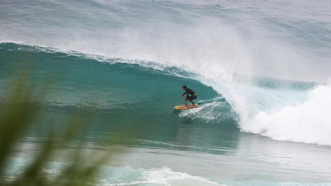 Surfers at Snapper Rocks and Kirra riding the Large swell produced by Cyclone OMA. Photograph : Jason O'Brien