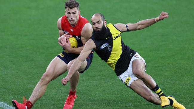 Richmond star Bachar Houli, right, tries to spoil Melbourne’s Jack Viney in Sunday’s match at the MCG. Picture: Michael Klein