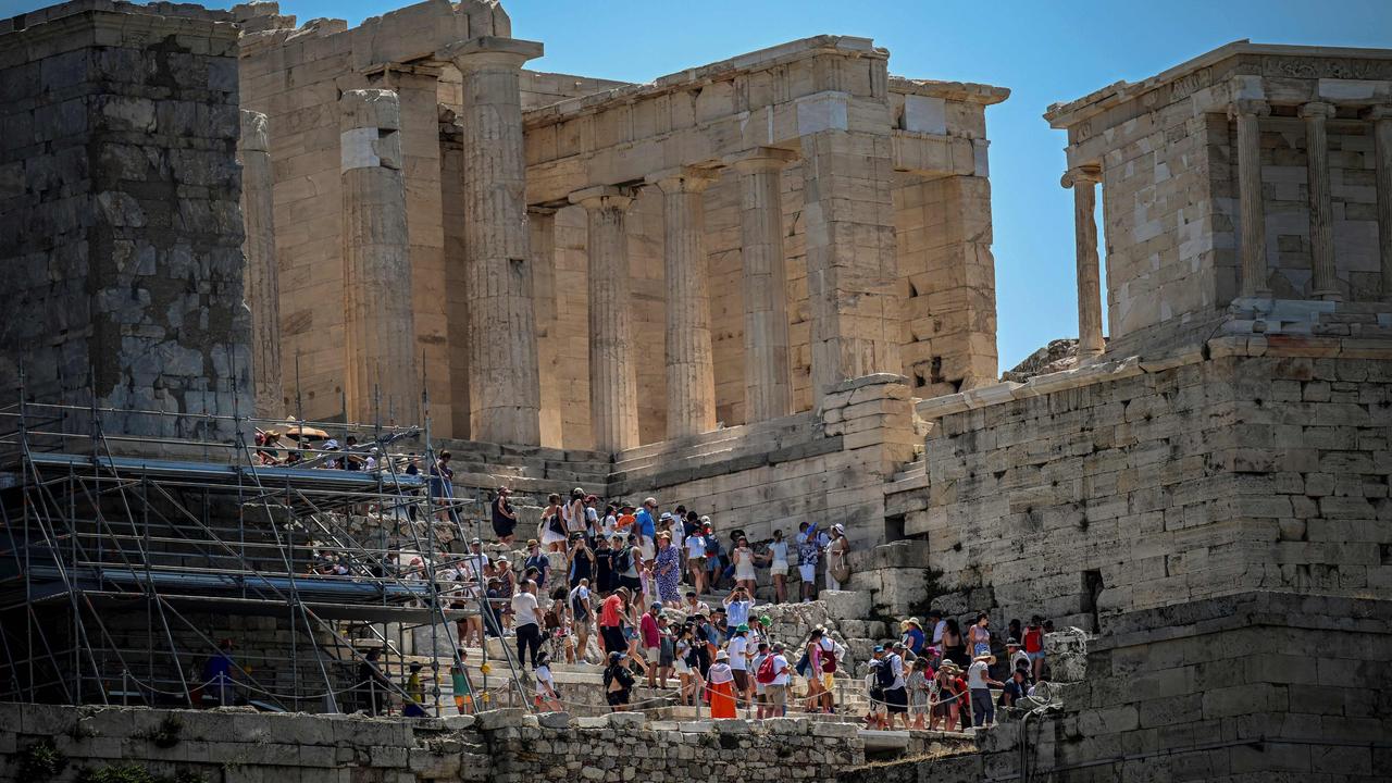 An influx of visitors forced Greece to cap the number of tourists visiting the Acropolis in Athens. Picture: Tzortzinis / AFP