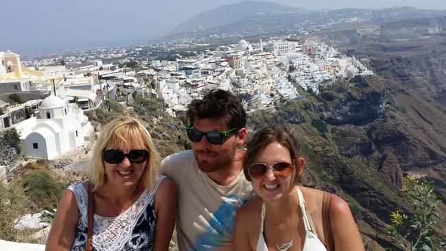 Sandy Dunn with her only son Josh and his long-term partner Kate Marwood on an overseas holiday. Picture: Supplied