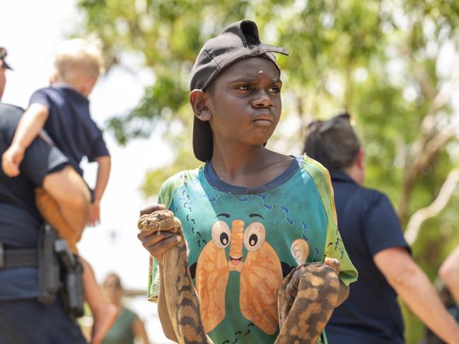 Gapuwiyak boy Abraham Ganambarr holding a File Snake at the AACAP closing ceremony. Picture: Floss Adams.