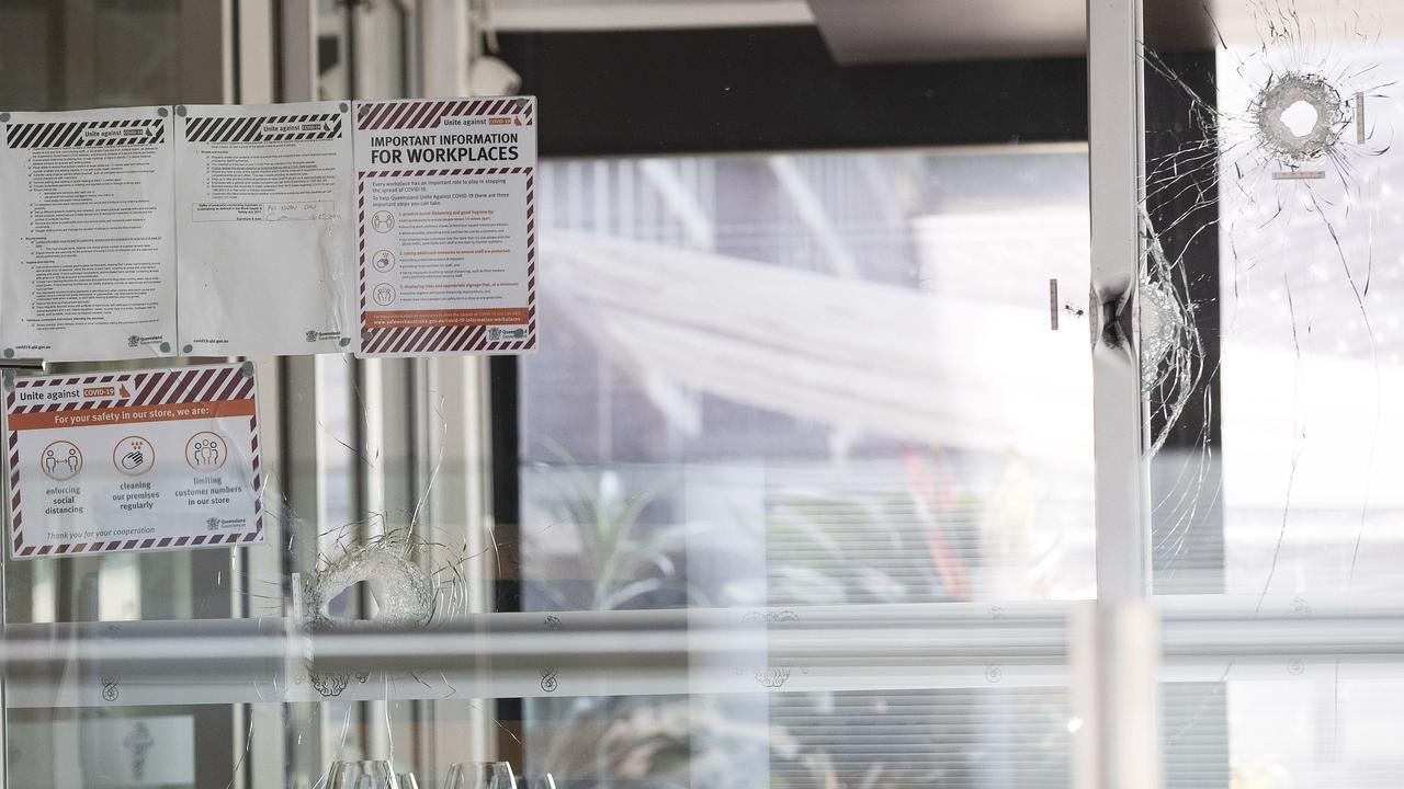 Bullet holes in the windows of Daniel Milos’ restaurant Barolos. Picture: Attila Csaszar