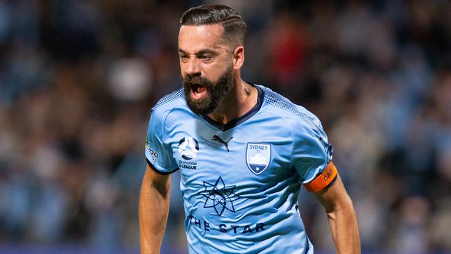 Alex Brosque celebrates his volleyed goal for Sydney FC against Melbourne Victory on Sunday night. Picture: AAP