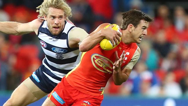 Jarryd Lyons in action for Gold Coast against Geelong.