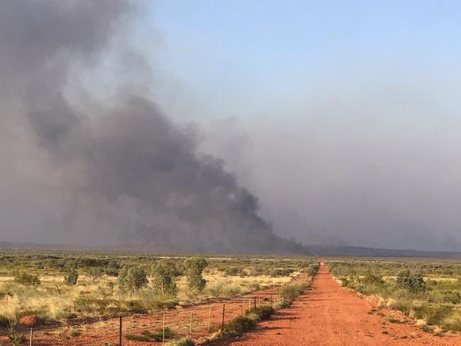 Volunteers and staff from Bushfires NT continue to battle out-of-control blazes in and around the lytwelepenty/Davenport Ranges National Park in Davenport. The national park will remain closed until at least November 4 as the fire is brought under control.