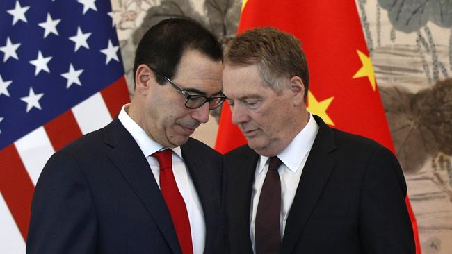 US Treasury Secretary Steven Mnuchin, left, and Trade Representative Robert Lighthizer at a recent group photo session in Beijing. Pic: AP