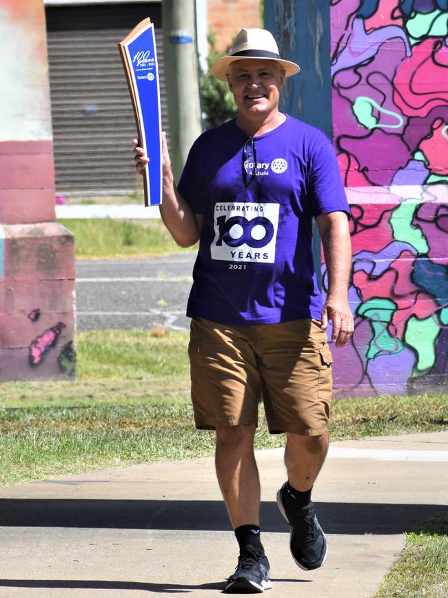 Grafton Midday Rotary member Johannes Venter leads the District 9640 Rotary 100 Baton Relay under the old Grafton Bridge on Friday, 5th February, 2021. Photo Bill North / The Daily Examiner