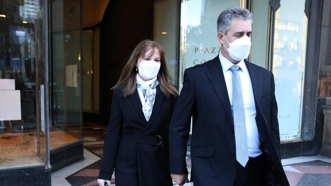 Professor Dianne Jolley leaves Downing Centre Court with her husband after being found guilty of sending herself fake threatening letters. Picture: NCA NewsWire / David Swift