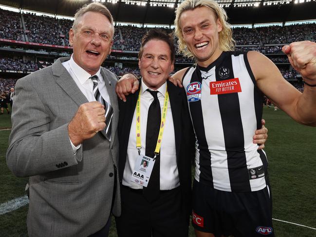 The Moores with Collingwood President Jeff Browne, whose links stretch back more than 40 years. Picture: Michael Klein