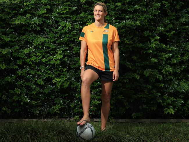 Retired Matilda's defender(1996-2009) Di Cleary poses with her former National representative soccer uniform and speaks with the Cairns Post about her career in Soccer.PICTURE: JUSTIN BRIERTY