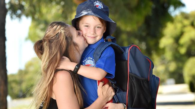 Jake Butler gets ready for his first day of school with mum Kate. Picture: Nicki Connolly.