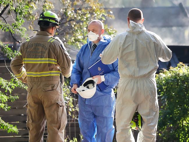 Fire Rescue investigators and forensic teams at the scene. Picture: Ian Currie