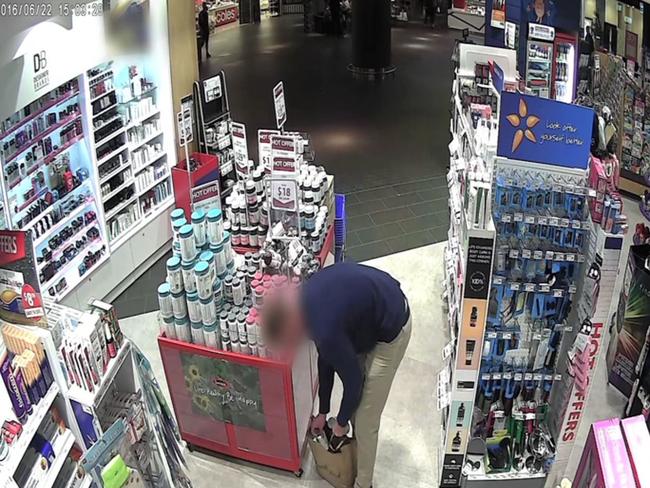 CCTV image shows a man stealing from a chemist in Zetland.