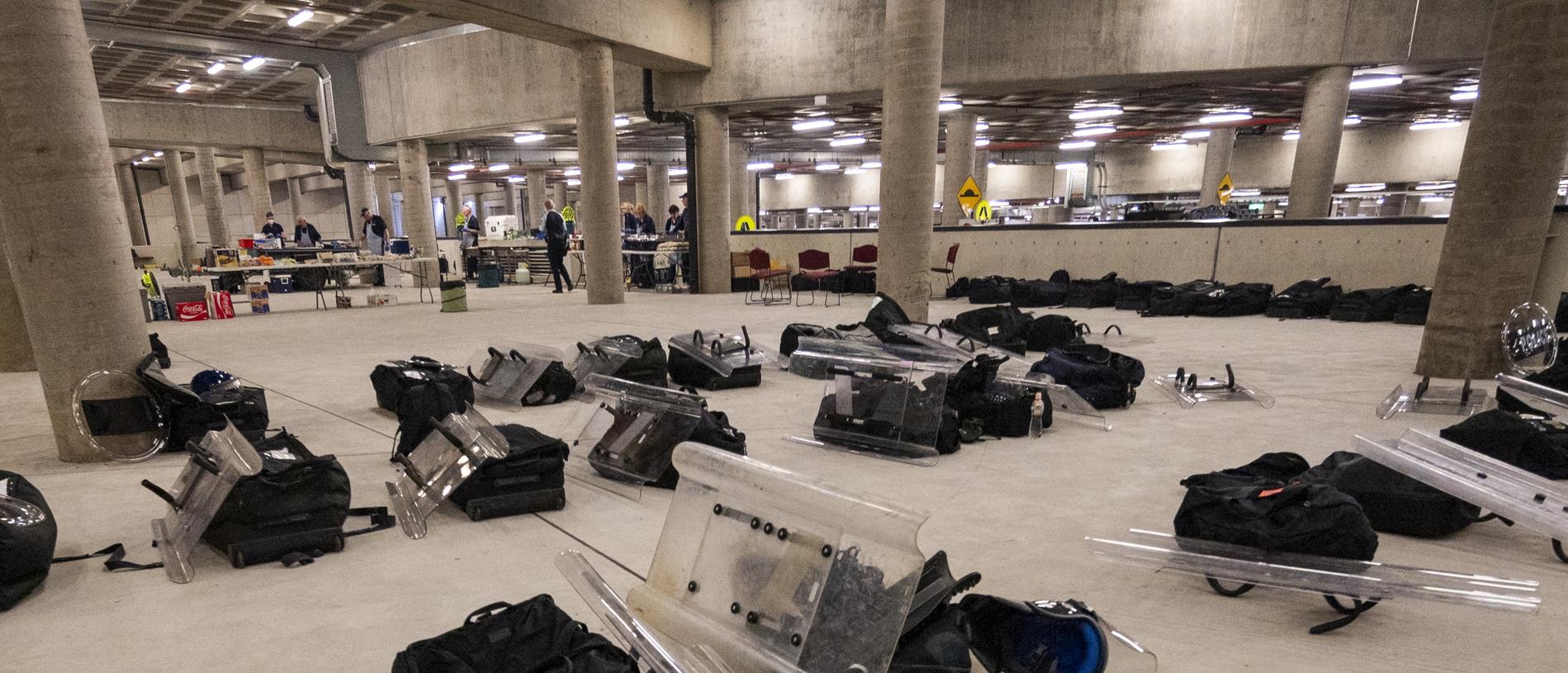 AFP set up underneath Parliament House while demonstrators against Covid-19 mandates protest above. Picture: NCA NewsWire/Martin Ollman