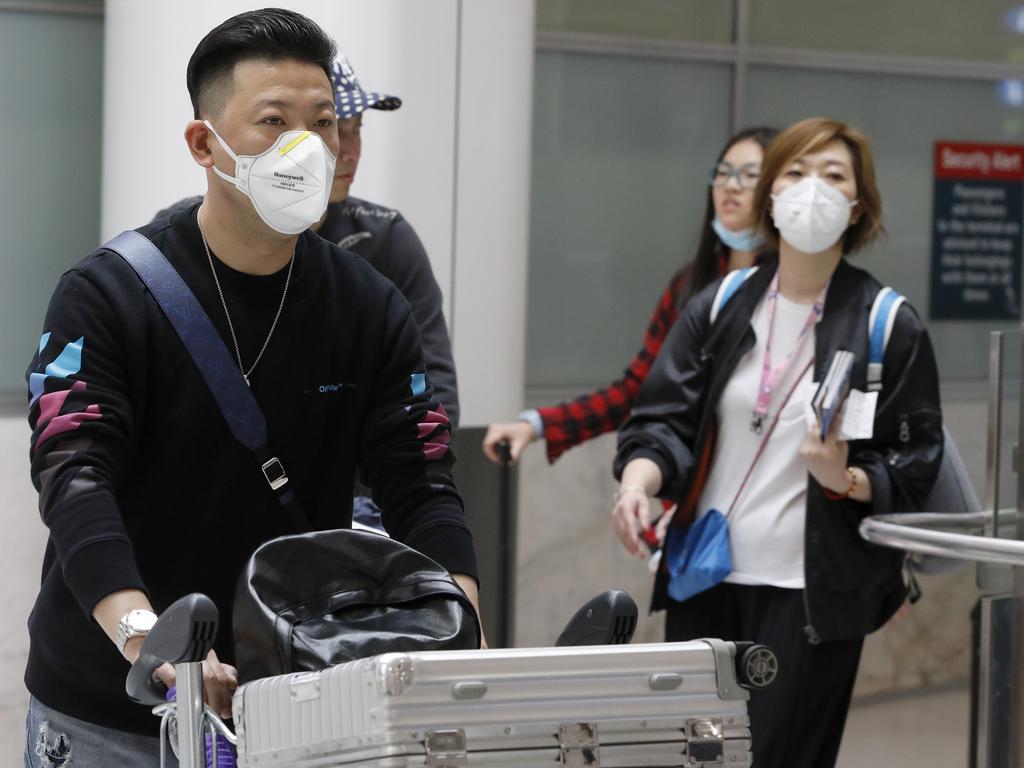 Passengers arrive in Sydney on a flight from China on Saturday. Picture: Chris Pavlich