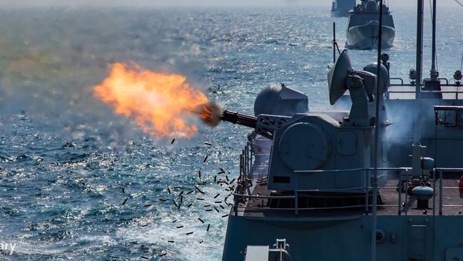 The guided-missile destroyer Shenzhen fires its close-in weapons system in a training exercise in the South China Sea. Picture: PLA