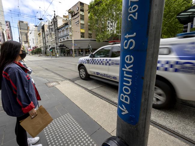 MELBOURNE, AUSTRALIA - NewsWire Photos October 19, 2021:  Police patrol the Bourke St Mall as the streets of Melbourne CBD remain quiet with Victoria only days away from Covid restrictions easing.Picture: NCA NewsWire / David Geraghty