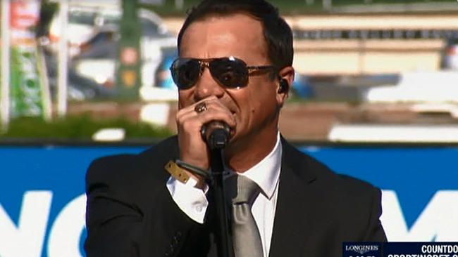 Shannon Noll sings during the Cox Plate at Moonee Ponds.