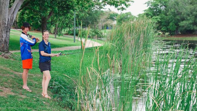 City of Palmerston alderman Lucy Morrison and her stepson Sol Healy-Morrison on the barra hunt in Palmerston. Picture: Glenn Campbell