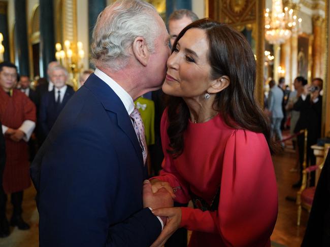 A kiss from a king to an Aussie princess. (Photo by Jacob King / POOL / AFP)